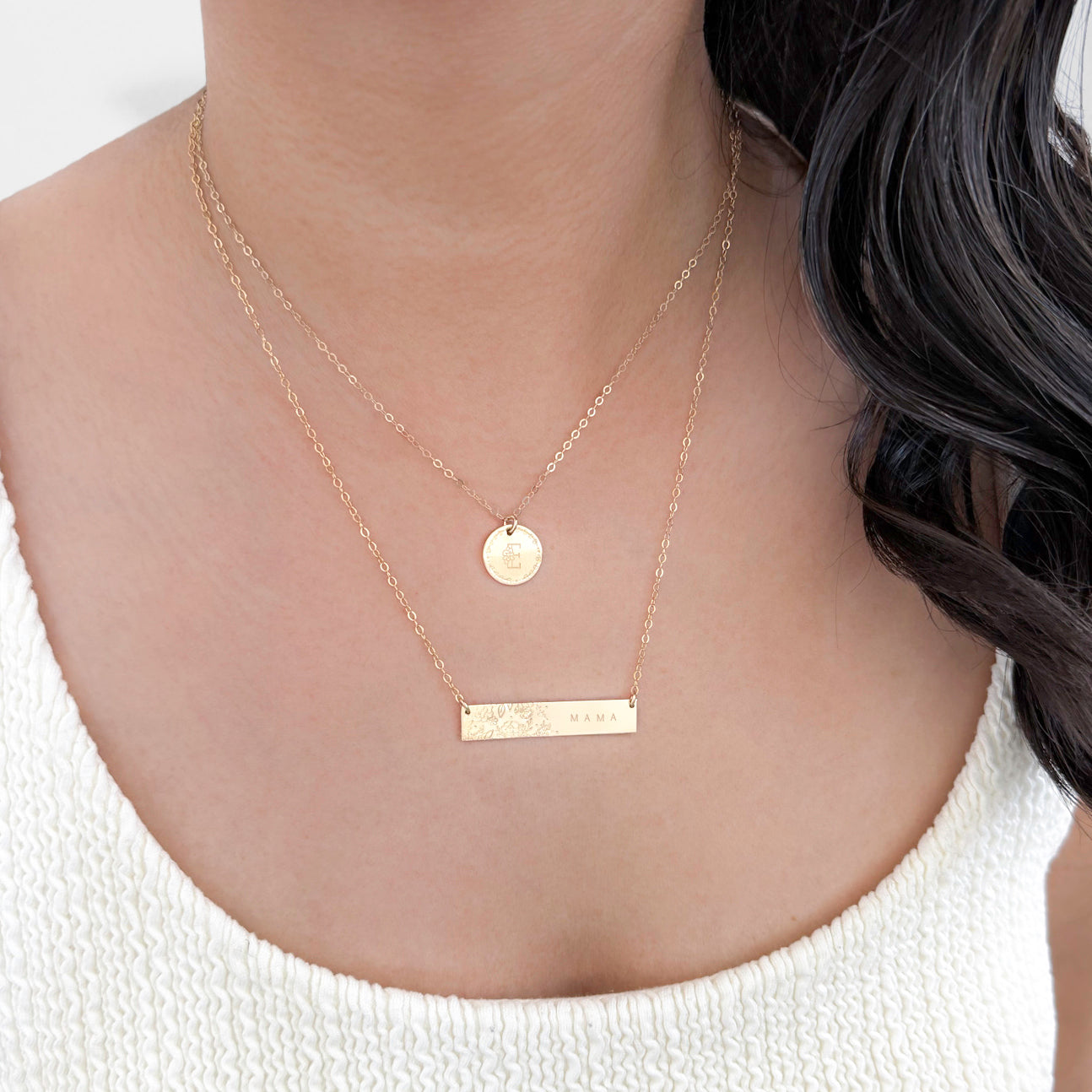 Model wearing the Wild Blooms Bar Necklace, showcasing how it lays along the neckline.