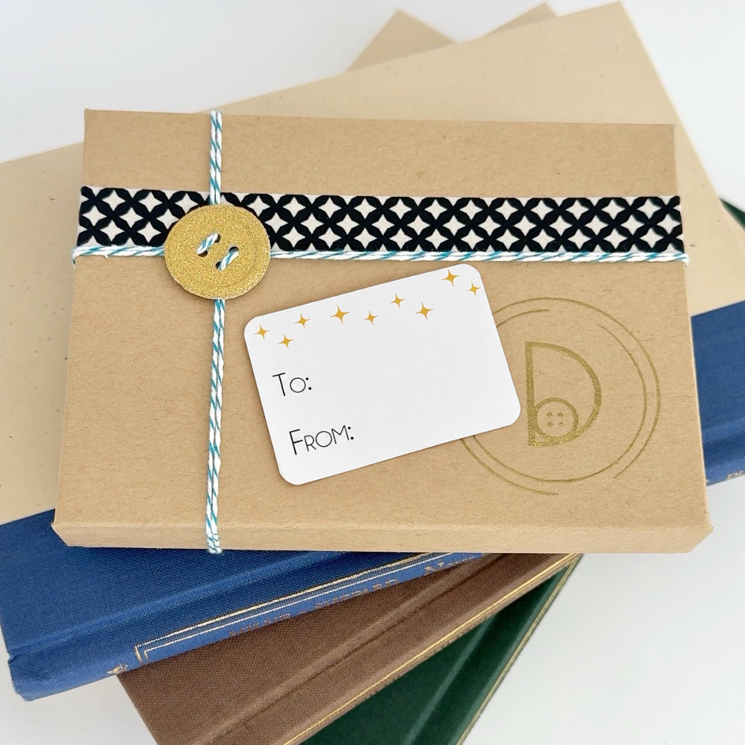 Personalized brass graduation bookmark packaged and ready to gift.