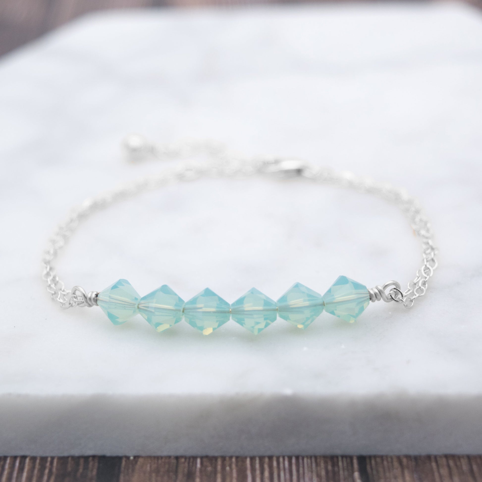 Swarovski Crystal Beaded Bar Bracelet, available in White Opal or Mint Opal bead colors and in 14k Gold-Filled or Sterling Silver chain and findings. Finished with a 1.5 inch extension chain.