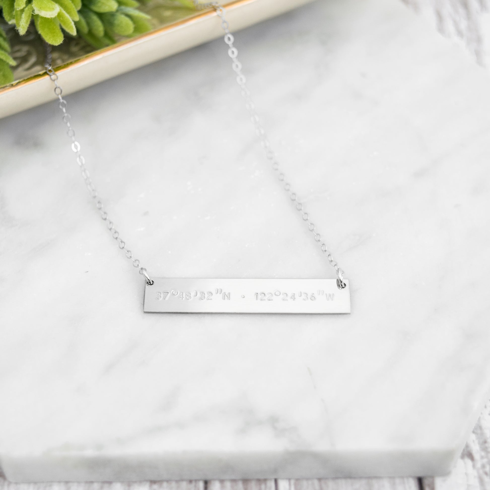 Hand stamped coordinates on a sterling silver bar