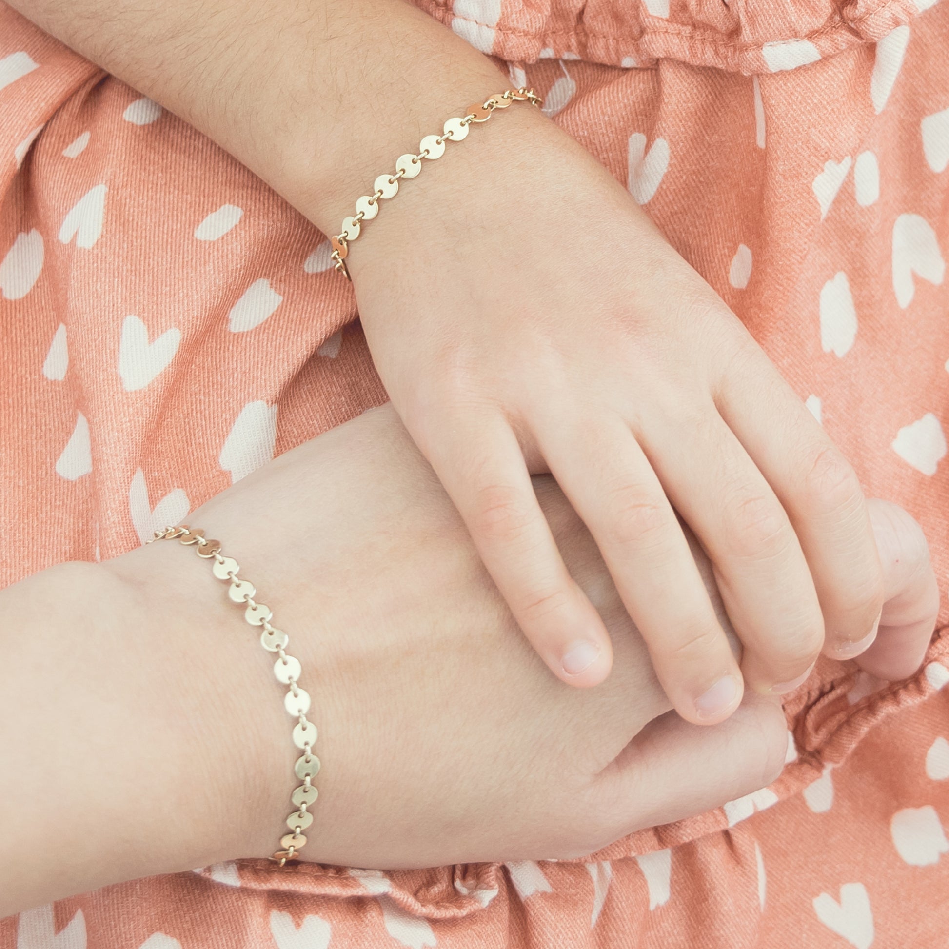 Disc chain bracelet with 1/2" extension in 14k gold-fill on adult and child model