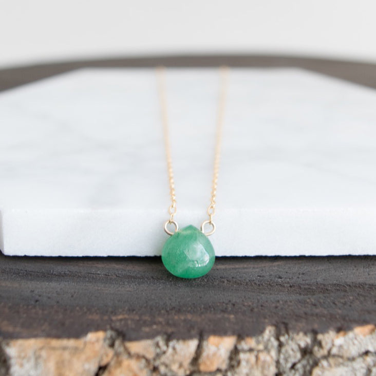 A smooth teardrop-shaped natural green aventurine bead is suspended on a 14k gold-filled or sterling silver wire