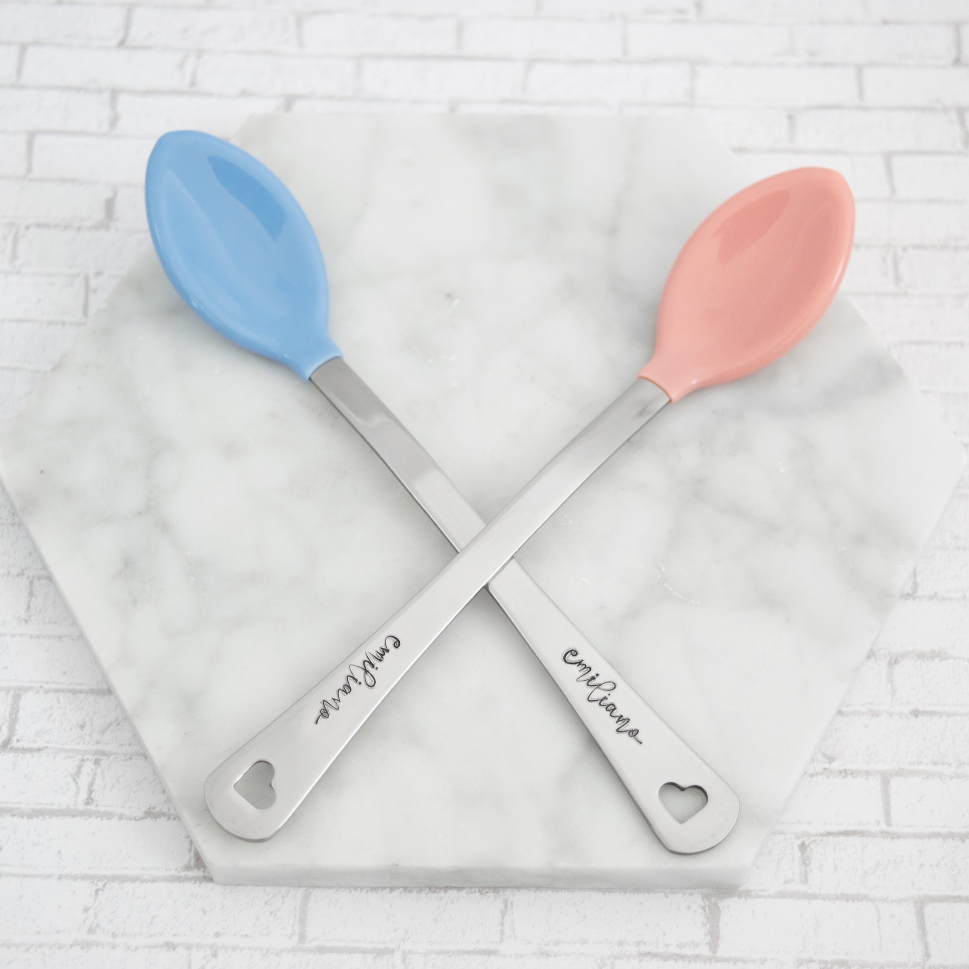 Personalized colorful baby spoon set. Set comes with two spoons that are hand stamped with baby name of choice. Spoon comes with heart cut out at end of handle.