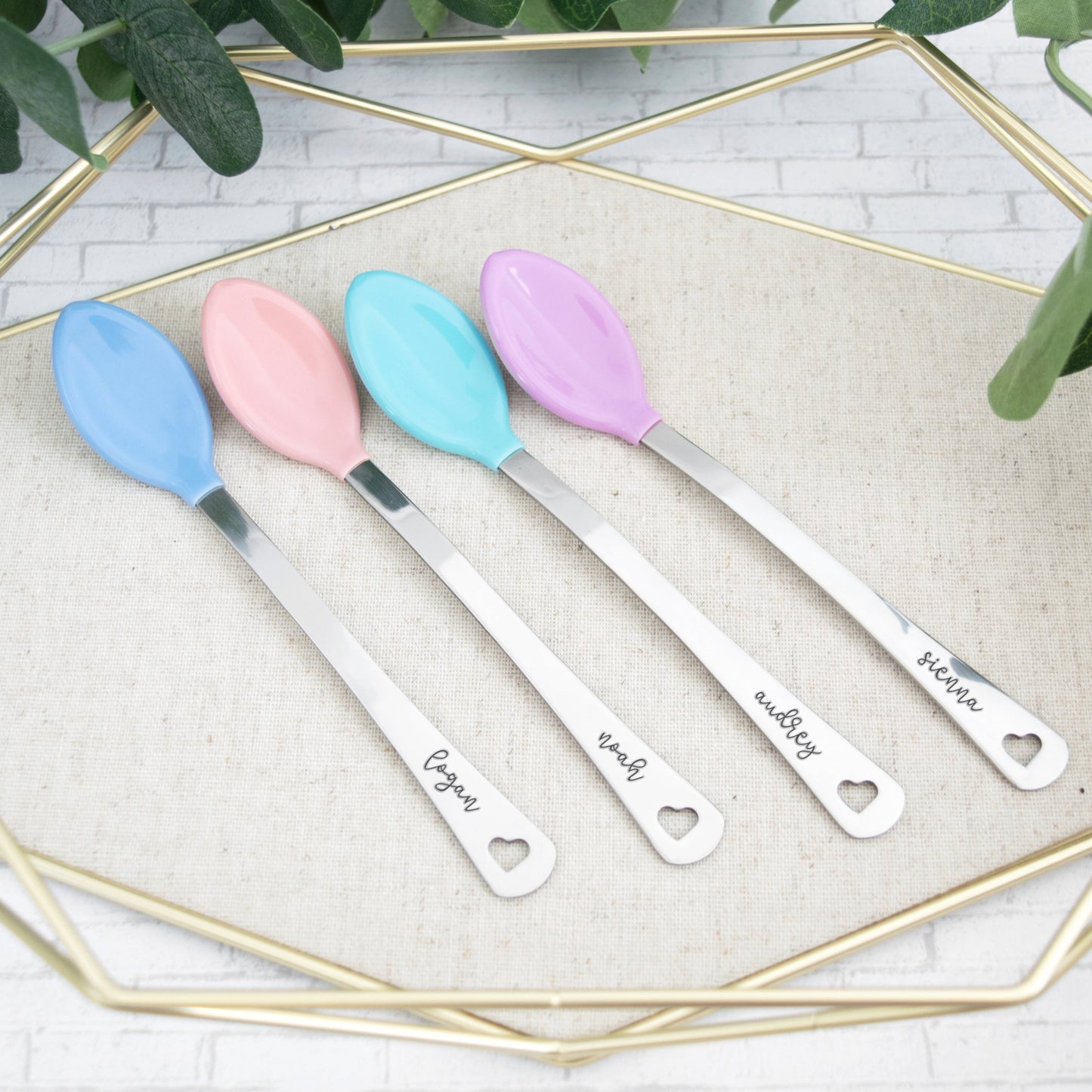 Personalized colorful baby spoon set. Set comes with two spoons that are hand stamped with baby name of choice. Spoon comes with heart cut out at end of handle.