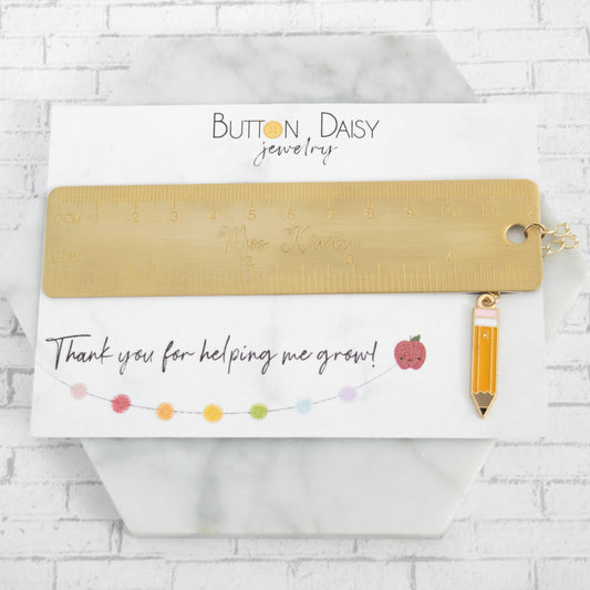 Personalized Teacher Brass Bookmark with pencil charm on card reading "Thank you for helping me grow!"