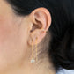 Cuff hoop earring in 14k gold-fill on model styled with Herkimer threader earrings