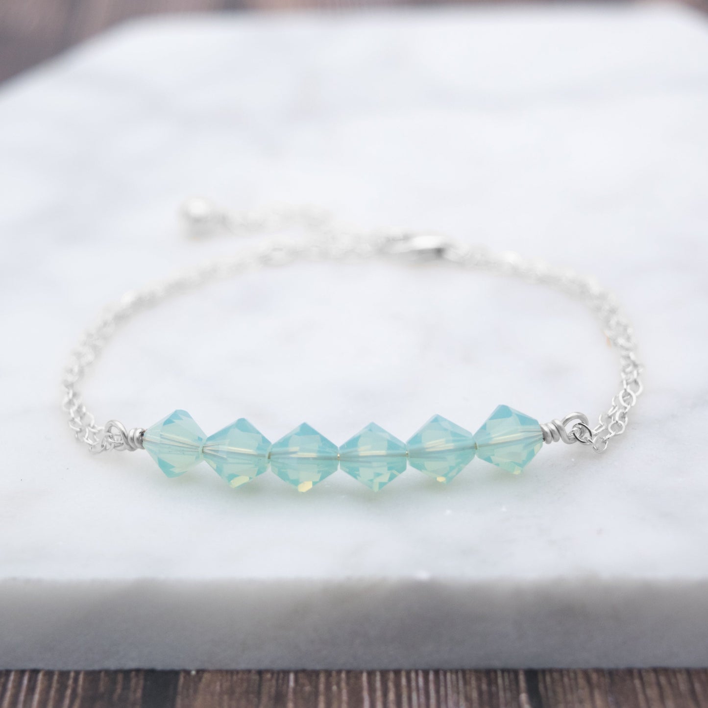 Swarovski Crystal Beaded Bar Bracelet, available in White Opal or Mint Opal bead colors and in 14k Gold-Filled or Sterling Silver chain and findings. Finished with a 1.5 inch extension chain.