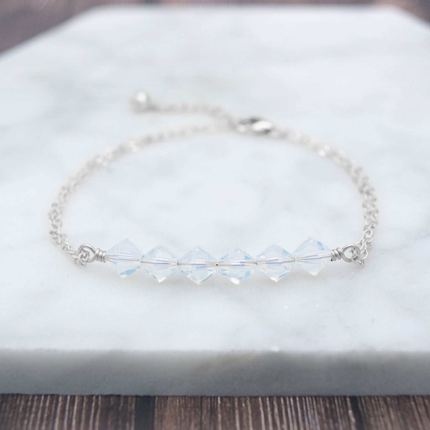 Swarovski Crystal Beaded Bar Bracelet, available in White Opal or Mint Opal bead colors and in 14k Gold-Filled or Sterling Silver chain and findings. Finished with a 1.5 inch extension chain.