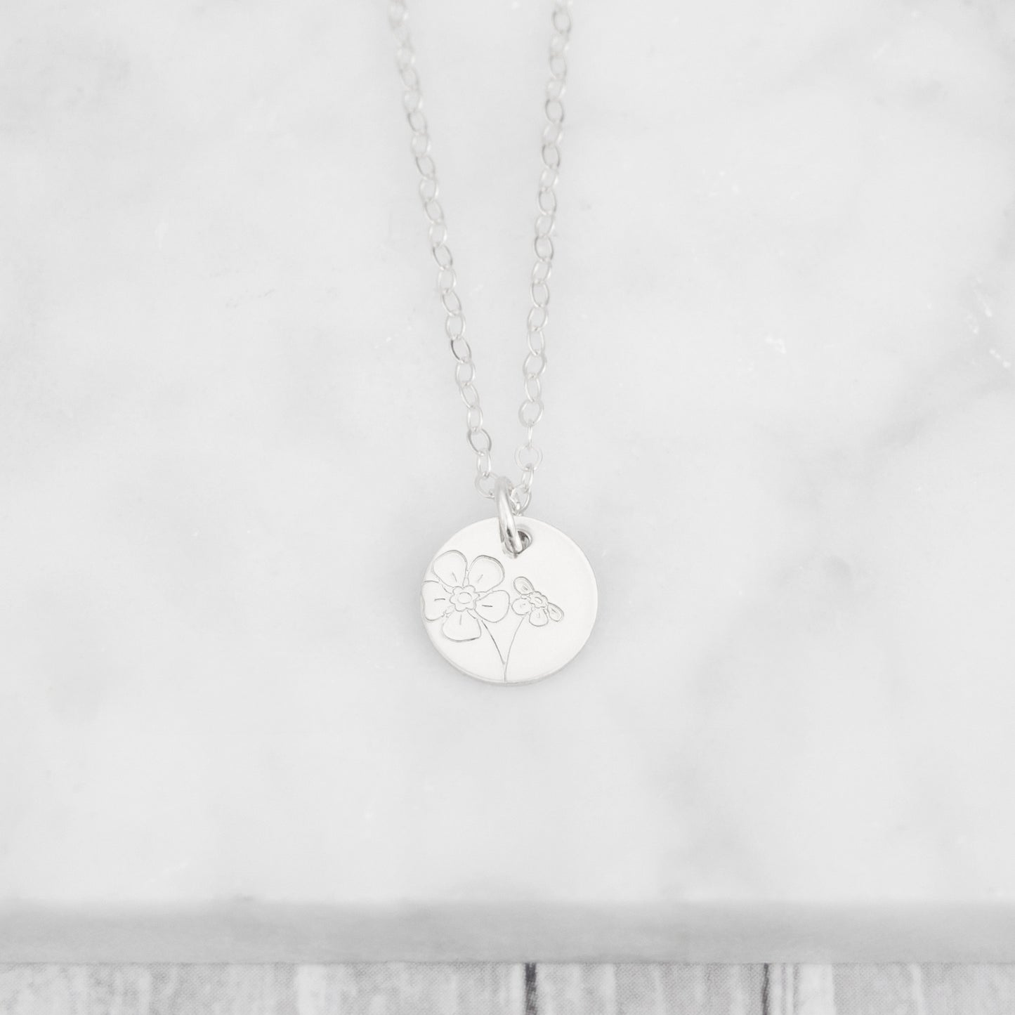 Floral Minima hand stamped 3/8" mini disc necklace with various flower options to choose from in sterling silver