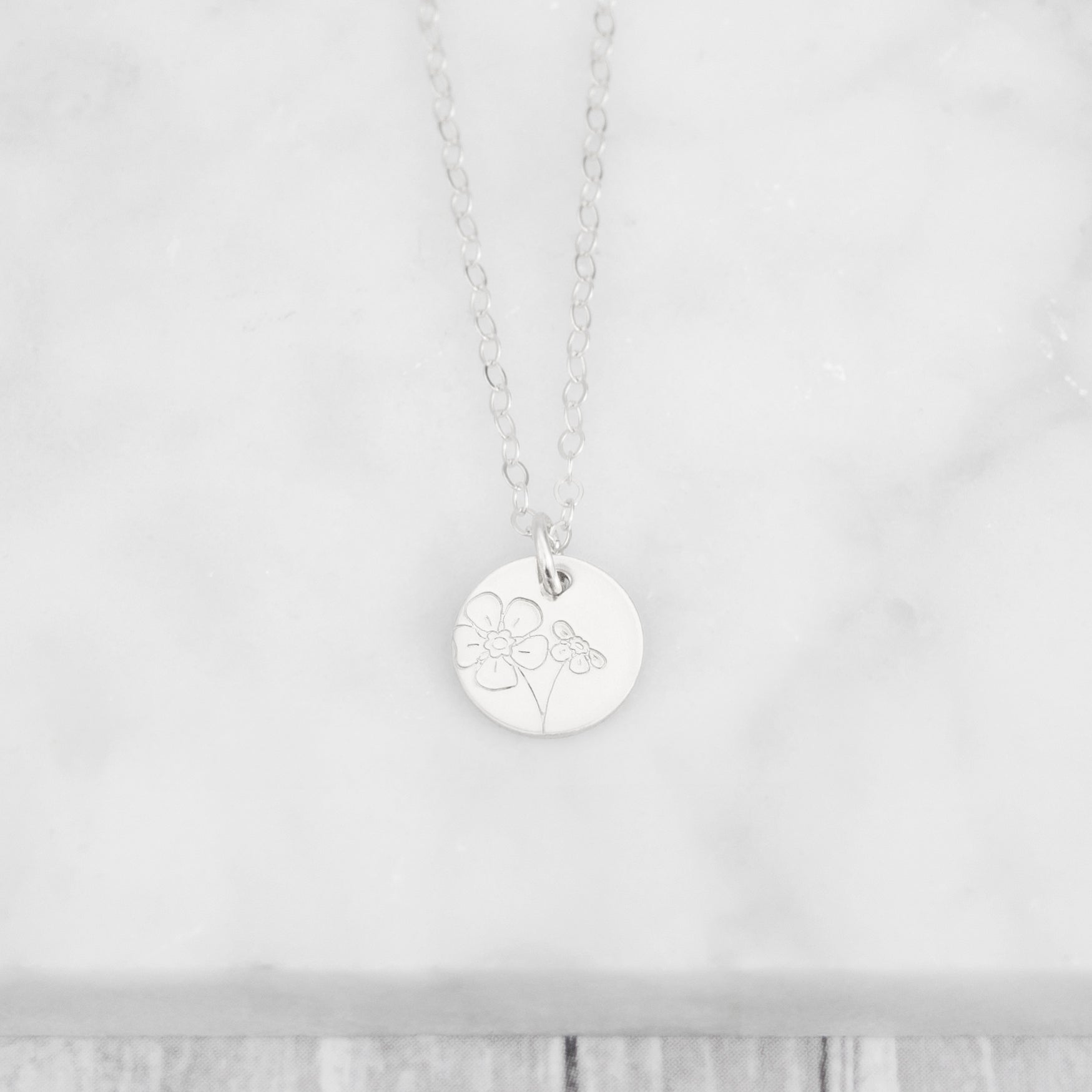 Floral Minima hand stamped 3/8" mini disc necklace with various flower options to choose from in sterling silver