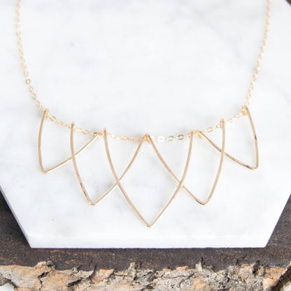 Sophisticated Hilary Curved Triangle Necklace - Geometric Handmade Jewelry. Five interlocking hammered V-shaped curved triangle wire necklace in 14k gold-fill materials