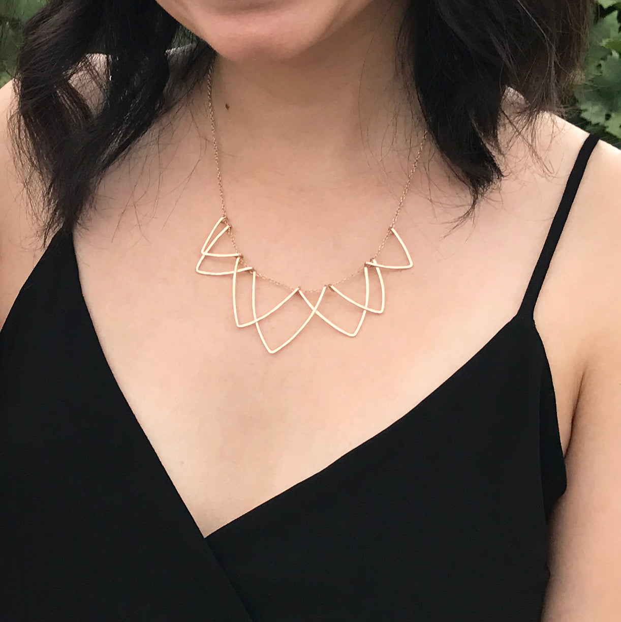 Sophisticated Hilary Curved Triangle Necklace - Geometric Handmade Jewelry. Five interlocking hammered V-shaped curved triangle wire necklace in 14k gold-fill materials