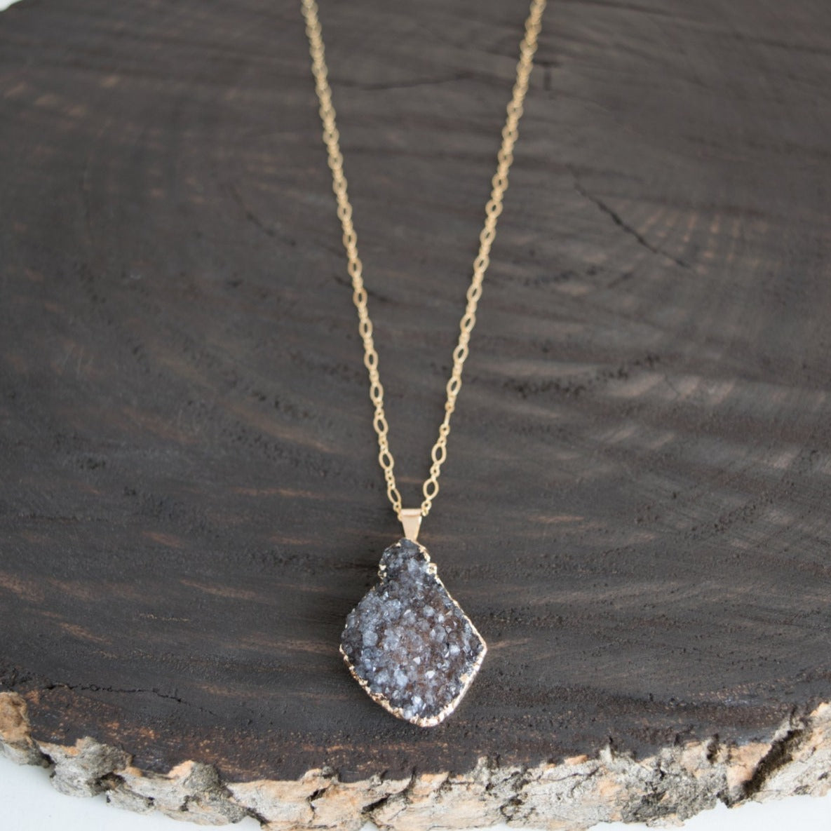 Druzy pendant with 24k gold electroplated edges on a 14k gold-filled oval long/short chain with personalized initial disc at clasp