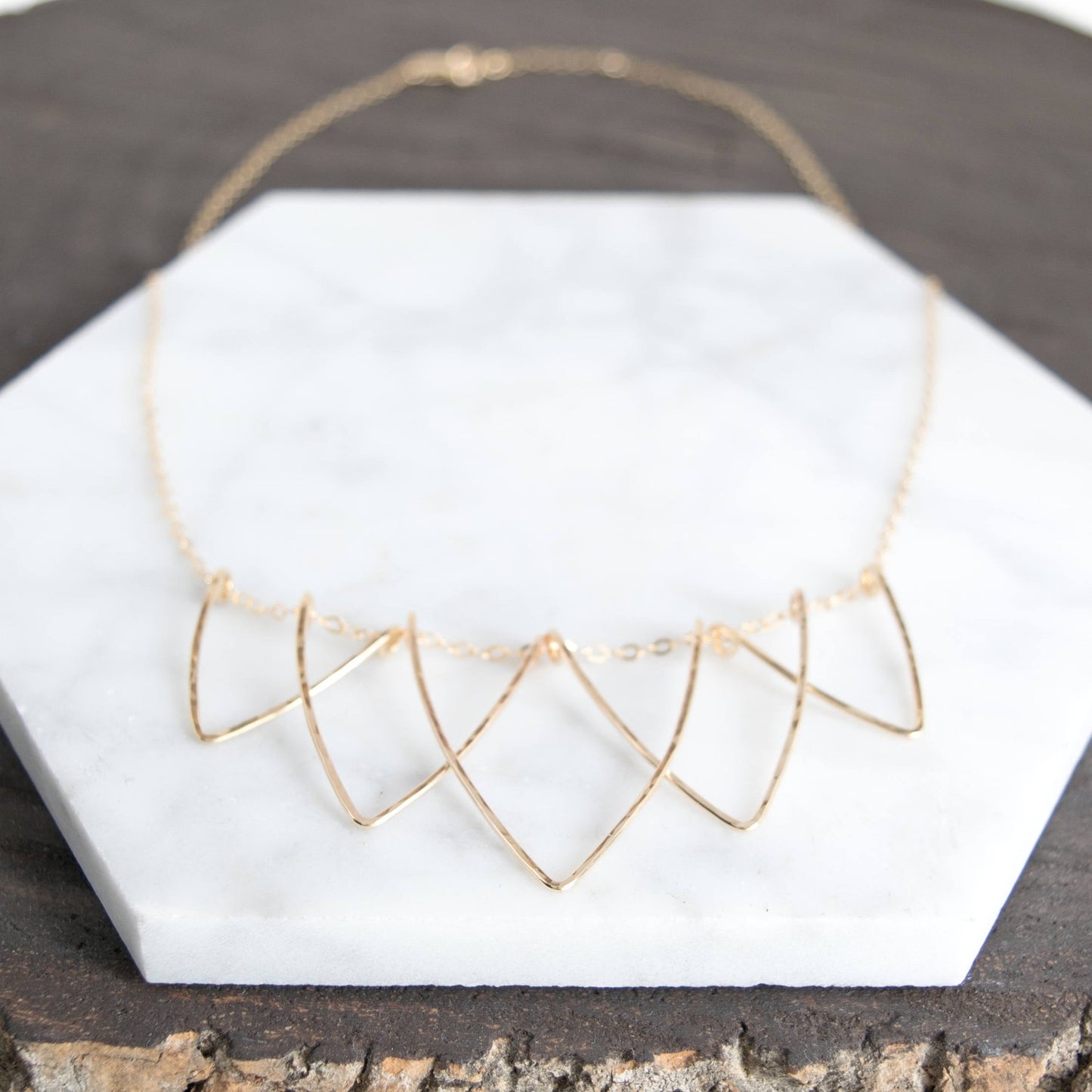 Sophisticated Hilary Curved Triangle Necklace - Geometric Handmade Jewelry. Five interlocking hammered V-shaped curved triangle wire necklace in 14k gold-fill materials