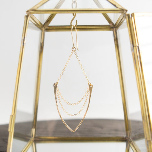 Multi-chain chandelier earrings featuring hammered v-shaped pendant suspended on a 14k gold-filled or sterling silver cable chain. These earrings dangle freely on hand-forged French ear wires.